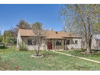 Charming single-story home with a well-maintained front yard, mature trees, and a welcoming entrance at 2865 S Fairfax St, Denver, CO 80222