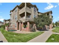 Attractive 3-story apartment building with brick and siding at 12926 Ironstone Way # 201, Parker, CO 80134