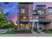 Charming three-story townhouse featuring a private balcony and modern design at 10305 Martin Luther King Blvd, Denver, CO 80238