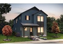 Charming two-story home boasts attractive curb appeal with landscaped yard and covered entryway at 8637 Middle Fork St, Littleton, CO 80125
