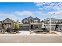 Charming two-story home with a covered porch and well-manicured landscaping at 8109 Mount Ouray Rd, Littleton, CO 80125