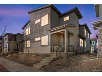 Charming home with a two-story elevation, covered front porch, and well-maintained landscaping at 1580 E 3Rd Ave, Longmont, CO 80501
