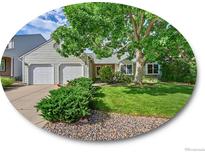 Charming home with a well-maintained front yard, mature tree and inviting curb appeal at 5319 E Davies Dr, Centennial, CO 80122