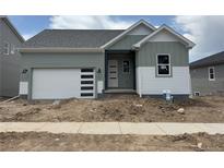 Charming single-story home with a modern garage door and stylish exterior paint at 138 S Seacrest St, Golden, CO 80401