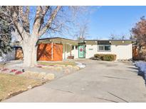 Ranch style home with landscaped yard and attached carport at 1488 S Fairfax St, Denver, CO 80222