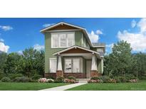 Charming two-story home featuring a covered porch, brick accents, and a beautifully landscaped front yard at 950 Promenade Dr, Superior, CO 80027