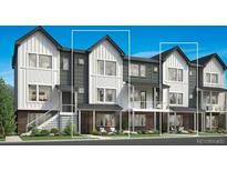 Modern townhome featuring a stylish facade, private patios, and inviting curb appeal in a well-maintained community at 700 Saddle Dr, Erie, CO 80516