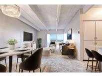 The living room features an attached dining room, city views and a decorative ceiling at 130 N Pearl St # 1606, Denver, CO 80203