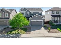 Charming two-story home with well-manicured lawn and a spacious two-car garage at 7686 Grady Cir, Castle Rock, CO 80108
