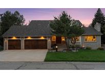 Charming two-story home with a brick exterior, mature trees, and a well-manicured lawn at 6128 Songbird Cir, Boulder, CO 80303