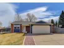 Charming single-Gathering home featuring a two-car garage and a well-maintained front yard at 5398 S Truckee Ct, Centennial, CO 80015