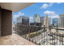 City view from this tiled balcony with wrought iron railing at 1020 15Th St # 15G, Denver, CO 80202