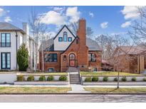 Charming brick home with manicured lawn and front garden, offering classic curb appeal at 474 S Gaylord St, Denver, CO 80209