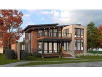 Stunning modern home with a two-story design, balconies, and a mix of wood and brick facade at 1016 24Th St, Golden, CO 80401