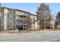 Front view of a two-story building with landscaping at 3184 S Heather Gardens Way # 403, Aurora, CO 80014
