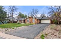Charming one-story home featuring a stone facade, an attached garage, and a well-maintained front yard at 4788 Briar Ridge Trl, Boulder, CO 80301