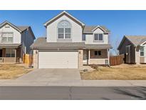 Charming two-story home featuring a two-car garage and well-maintained front yard at 2765 Fernwood Pl, Broomfield, CO 80020