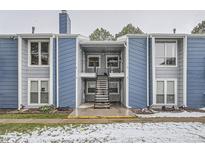 Charming condo building featuring light blue siding and exterior stairs at 2215 E Geddes Ave # P08, Littleton, CO 80122