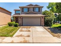 Charming two-story home features a two-car garage and well-maintained front yard at 1371 W 133Rd Way, Denver, CO 80234