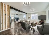 Bright and airy living room featuring an open floor plan, modern furnishings and stylish decor throughout at 5050 Steele St, Denver, CO 80216