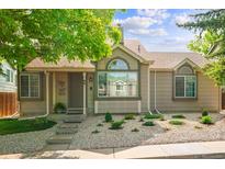 Charming single-story home with stone landscaping and a well-maintained front yard at 98 N Quicksilver Ave, Castle Rock, CO 80104