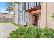 Charming exterior showcasing a well-maintained entrance and quaint bench seating at 865 S Quebec St # 101B, Denver, CO 80247