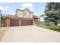 Charming two-story home featuring a spacious driveway and a two-car garage at 10890 Depew Pl, Broomfield, CO 80020