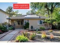 Charming ranch home featuring solar panels and a beautifully landscaped front yard at 1275 Fairfax St, Denver, CO 80220