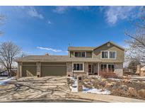 Charming home with a three car garage, brick accents, and mature landscaping at 3982 W 103Rd Ave, Westminster, CO 80031