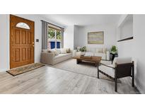 Bright living room featuring modern furniture, large windows, and stylish decor at 1759 Cedar St, Broomfield, CO 80020