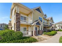 Inviting townhome with charming stone accents and a private balcony for outdoor enjoyment at 9434 Ashbury Cir # 203, Parker, CO 80134