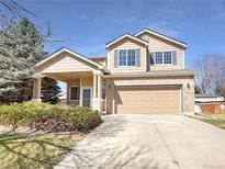 Charming two-story home with a two-car garage and well-maintained landscaping at 441 Grey Swallow St, Brighton, CO 80601