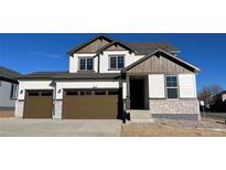 Charming two-story home featuring a two-car garage and a welcoming front porch at 16810 Mckay Dr, Mead, CO 80542
