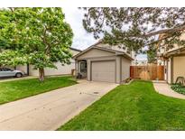 Charming exterior featuring a well-maintained lawn and an attached one car garage at 9328 Fenton Ct, Westminster, CO 80031