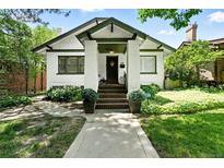 Charming, Craftsman style home with a manicured front yard and inviting entryway at 635 Fillmore St, Denver, CO 80206