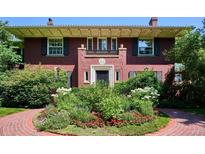 Charming brick home with a manicured front garden featuring a brick walkway at 2215 E 7Th Avenue Pkwy, Denver, CO 80206