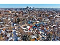 Stunning aerial view of home's location, showcasing its proximity to the city skyline at 3323 W Hayward Pl, Denver, CO 80211