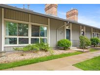 Charming townhouse showcasing mature landscaping, a well-kept walkway, and cozy, welcoming facade at 6495 E Happy Canyon Rd # 171, Denver, CO 80237