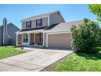 Charming two-story home with attached garage and well-maintained front yard at 714 Sedge Way, Lafayette, CO 80026