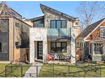 Contemporary two-story home featuring a stone facade and modern architectural details at 4426 Utica St, Denver, CO 80212