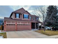 Charming two-story home with a three-car garage and well-manicured lawn at 5405 S Sicily St, Aurora, CO 80015
