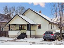 Cute bungalow style home with front porch and mature trees at 141 N 5Th Ave, Brighton, CO 80601