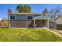 Charming two-story home with a combination of brick and siding, nestled on a well-maintained lawn at 9540 King Way, Westminster, CO 80031
