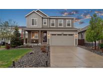 Charming two-story home with a well-manicured front yard and a spacious two-car garage at 16400 Alberta Dr, Parker, CO 80134
