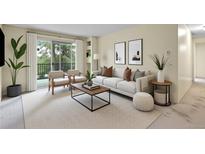 Bright living room featuring neutral tones, a sliding glass door, and contemporary furnishings at 2325 S Linden Ct # 206, Denver, CO 80222