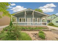 Charming blue bungalow features a covered porch, updated landscaping and a basketball hoop at 280 Pierce St, Erie, CO 80516