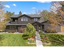 Stunning home with professionally landscaped yard and charming exterior elevation at 970 S Steele St, Denver, CO 80209