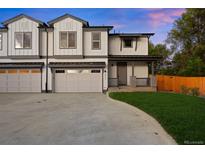 Charming townhome featuring a two-car garage and a cozy front porch in a well-maintained community at 4026 Upham St, Wheat Ridge, CO 80033