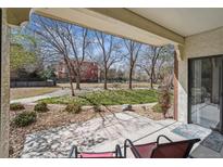 Relax on this covered patio with views of the landscaped grounds at 13950 E Oxford Pl # B105, Aurora, CO 80014