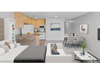 Open-concept living room, kitchen, and dining area with a breakfast bar and modern decor create an inviting and functional space at 2500 S York St # 310, Denver, CO 80210